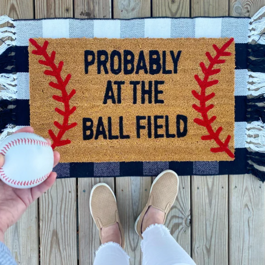Probably at the Ball field Doormat