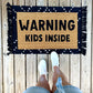 Warning kids inside doormat